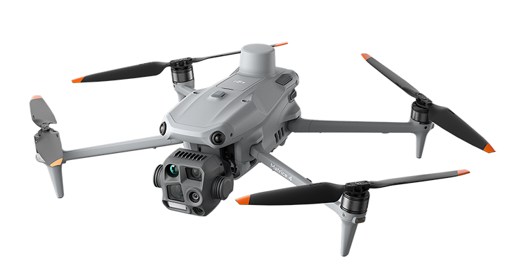 DJI Matrice 4T (M4T) airframe. Folding quadcopter with the integrated thermal + visible + laser-rangefinder gimbal payload mounted on the nose.
